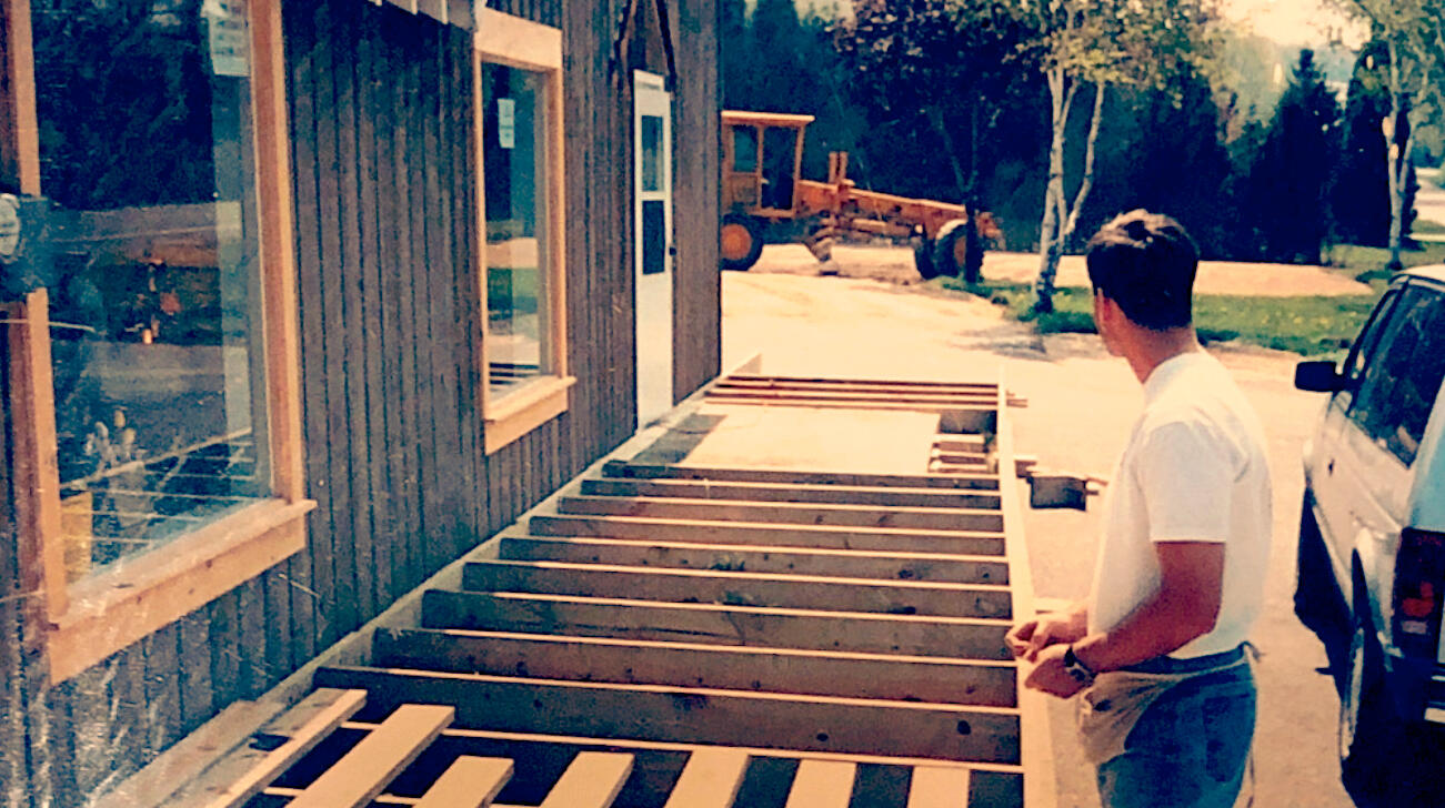 Building the Dream! This is me, building Liberty Grove Market Place, one board at a time. My dad captured this moment—we worked side by side every day, while my mom ran one of our other stores, generating the cash to buy more boards, more nails, and keep the dream alive!